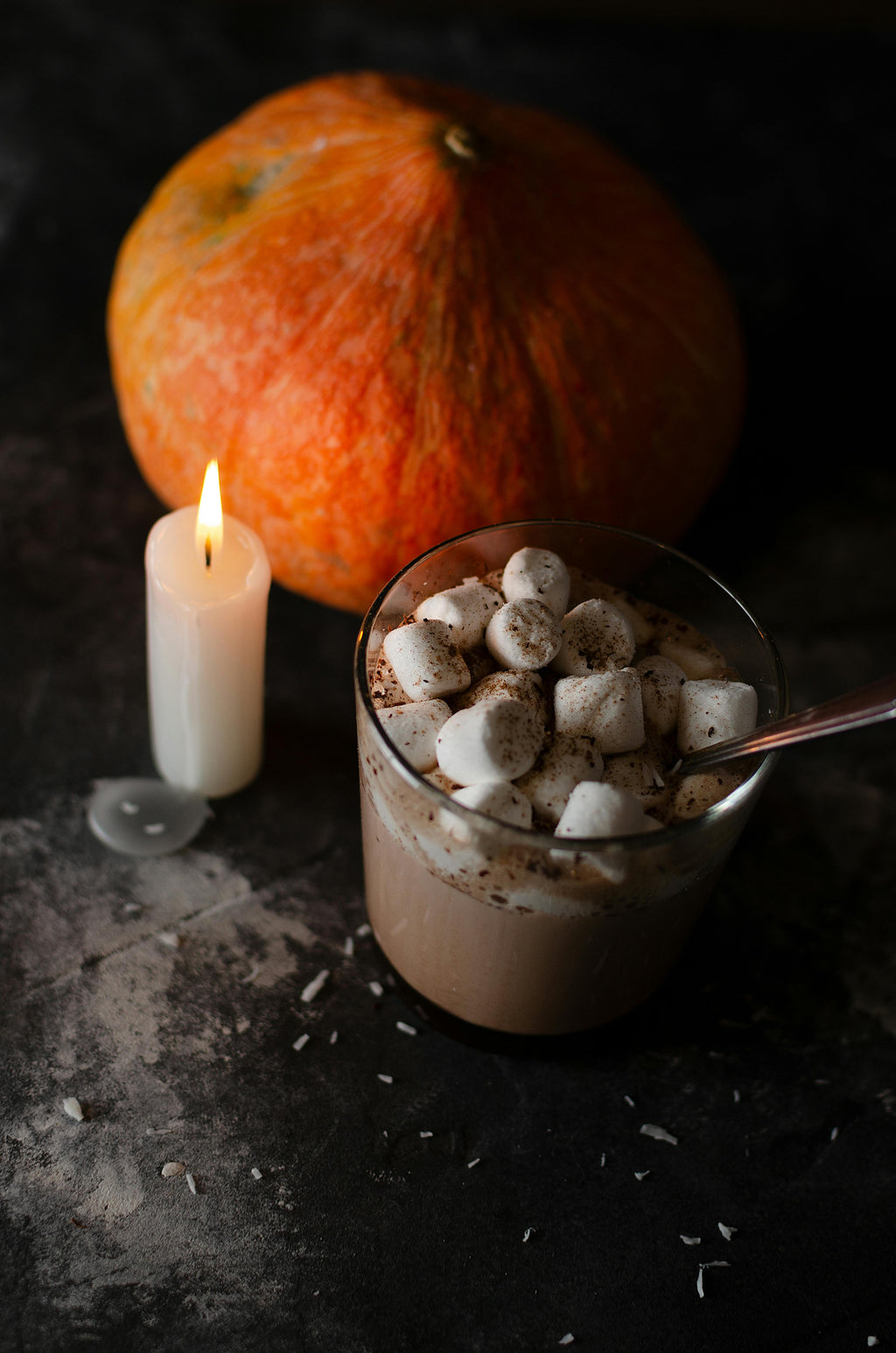 Photo by Александр Трубицын from Pexels: https://www.pexels.com/photo/orange-pumpkin-beside-white-candle-10117406/